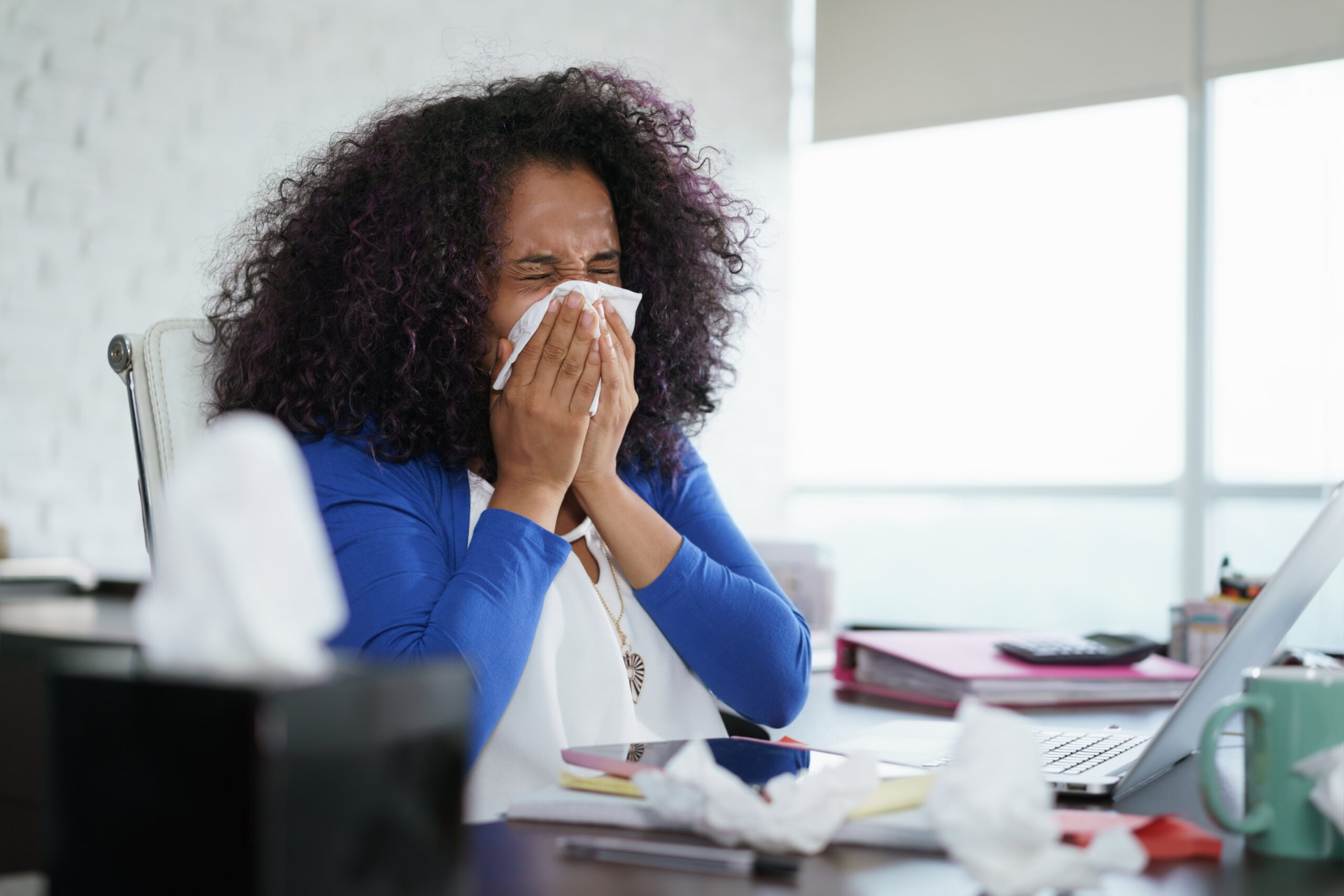 sick-african-american-girl-working-from-home-office-ill-young-black-woman-with-cold-si-SBI-330254525-scaled-1