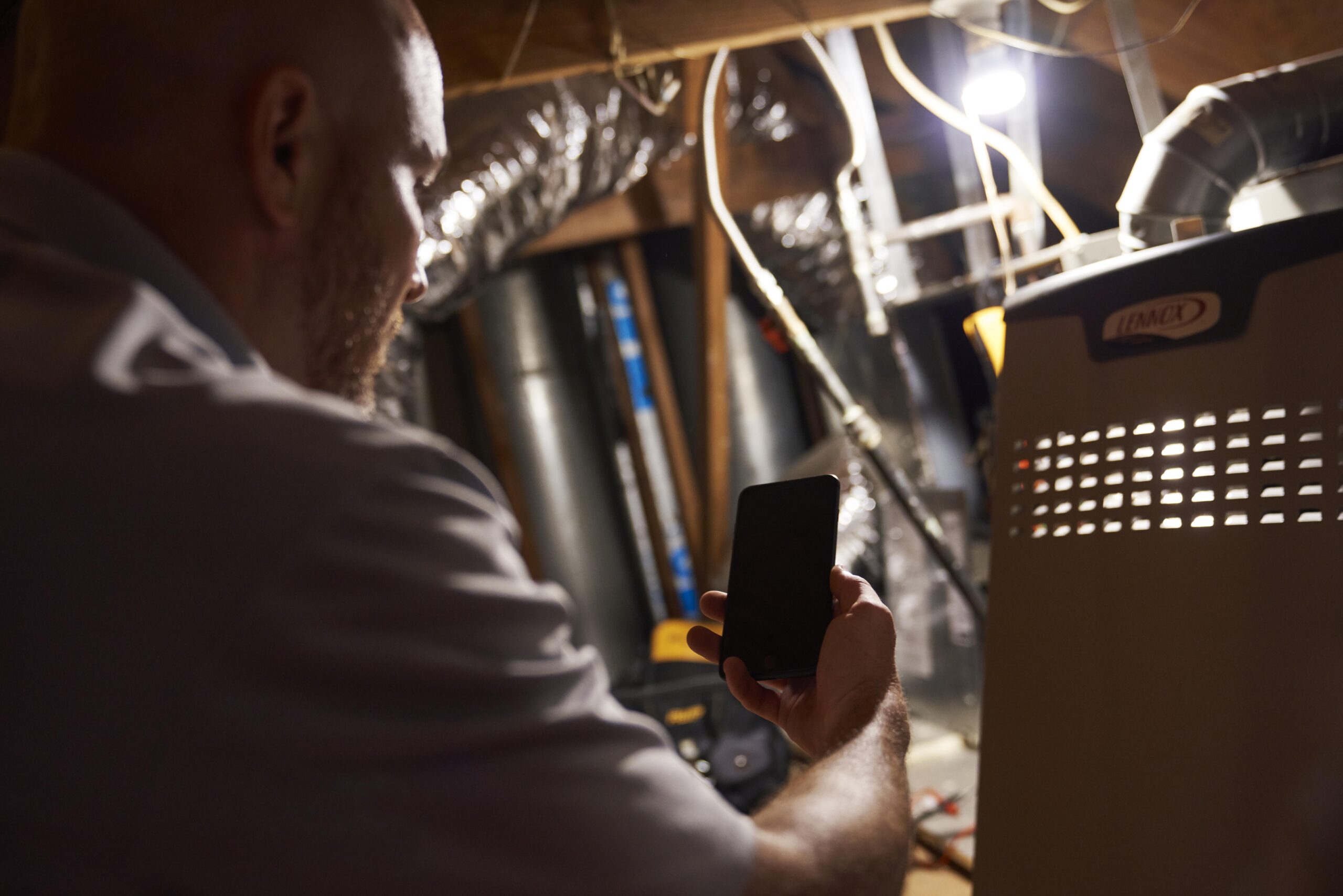 HVAC in an attic repairing a heating system